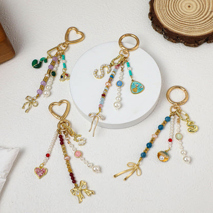 Personalized beaded keychains, letter pendant keychains, pearl keychains, bag charms, personalized keychains, car keychains, birthday gifts.