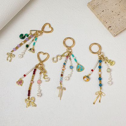 Personalized beaded keychains, letter pendant keychains, pearl keychains, bag charms, personalized keychains, car keychains, birthday gifts.